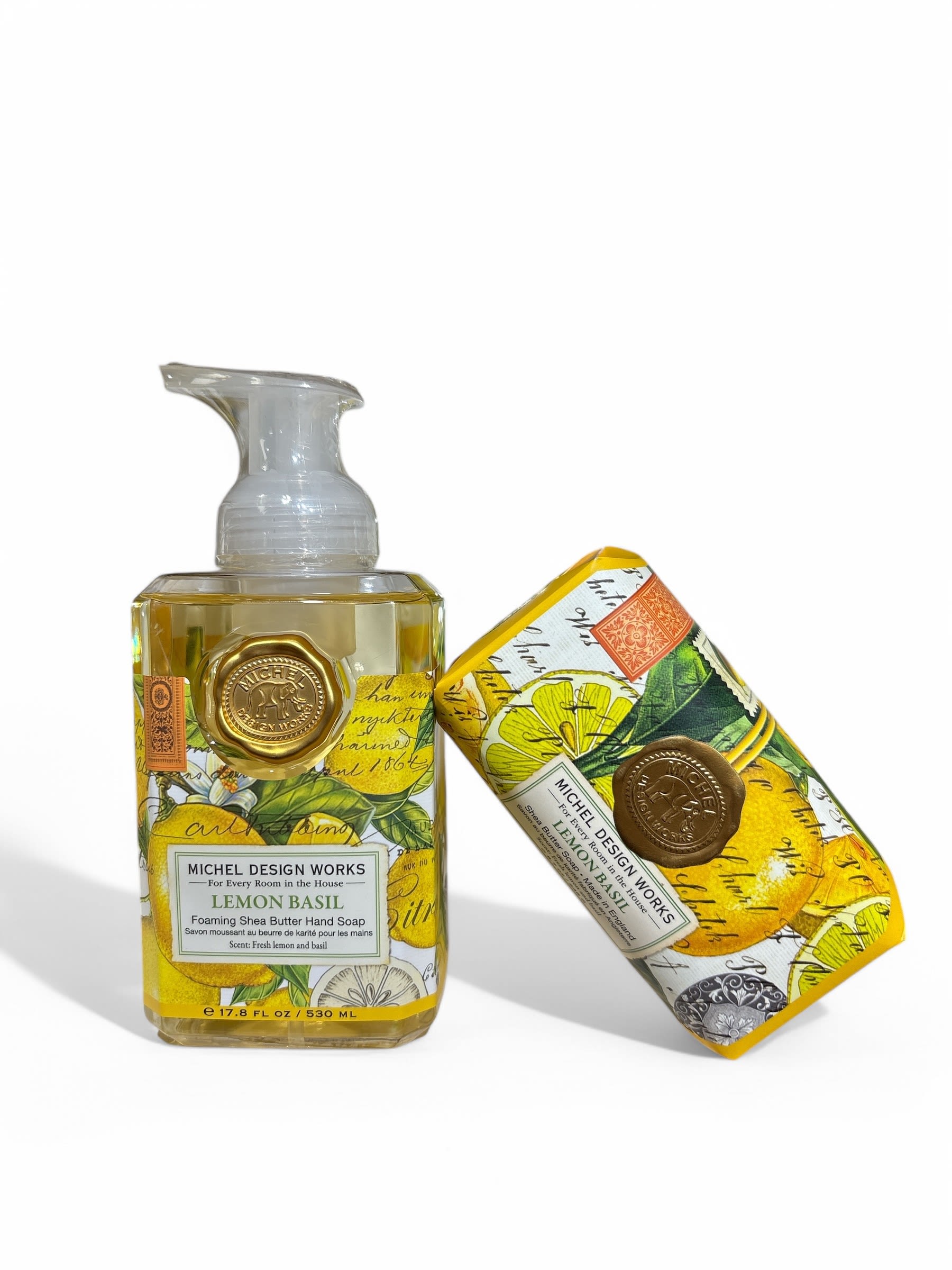 Two lemon basil foaming hand soap bottles with yellow citrus labels