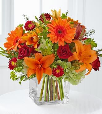 Falling for Fall - Orange gerberas, orange lilies and fall flowers fill up this vase, just in time for the season!
