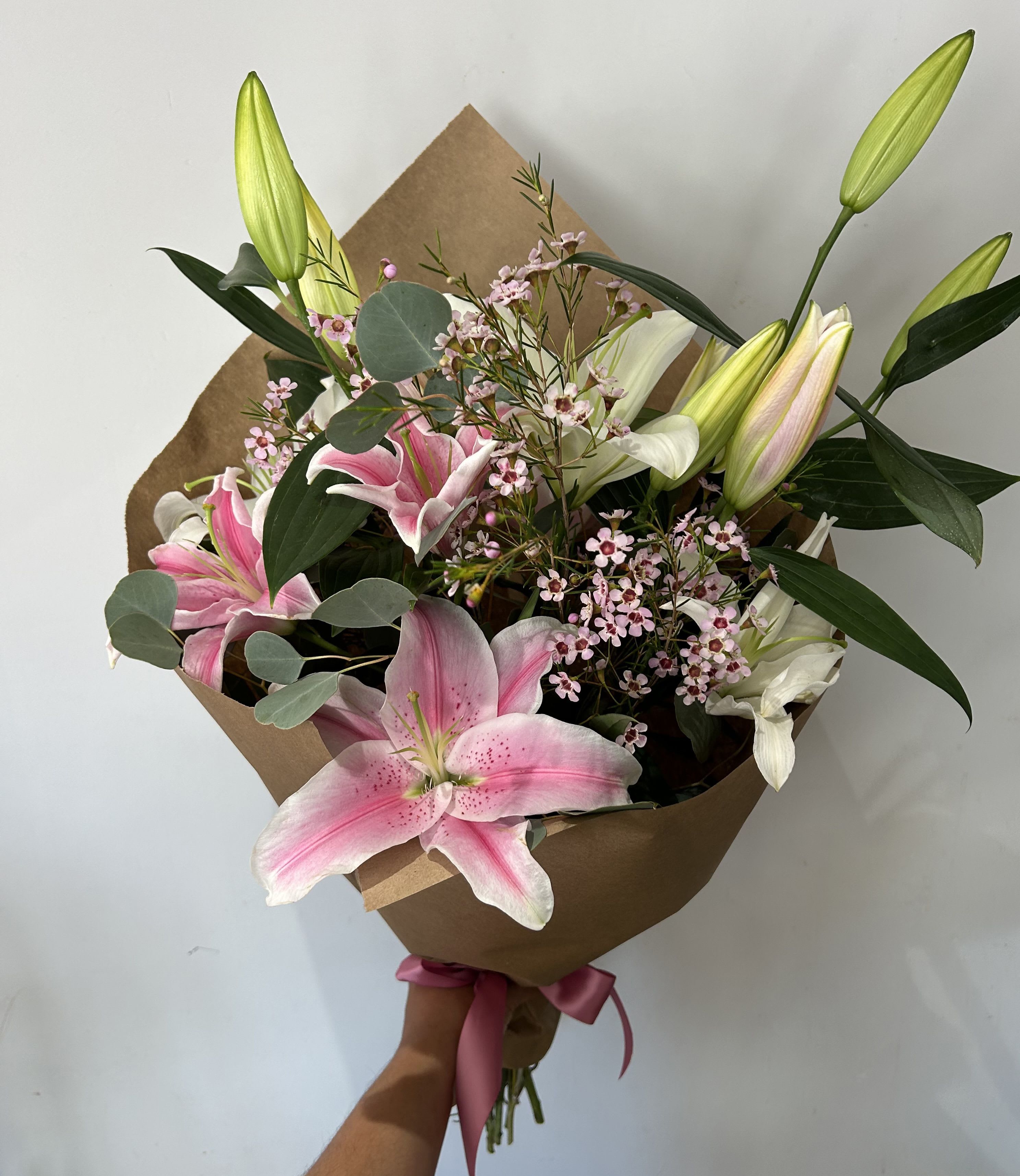 Stargazing Love  - Mix color lilies arranged into a hand-tied bouquet with fillers and greens. (no vase, NOT CAT-FRIENDLY)