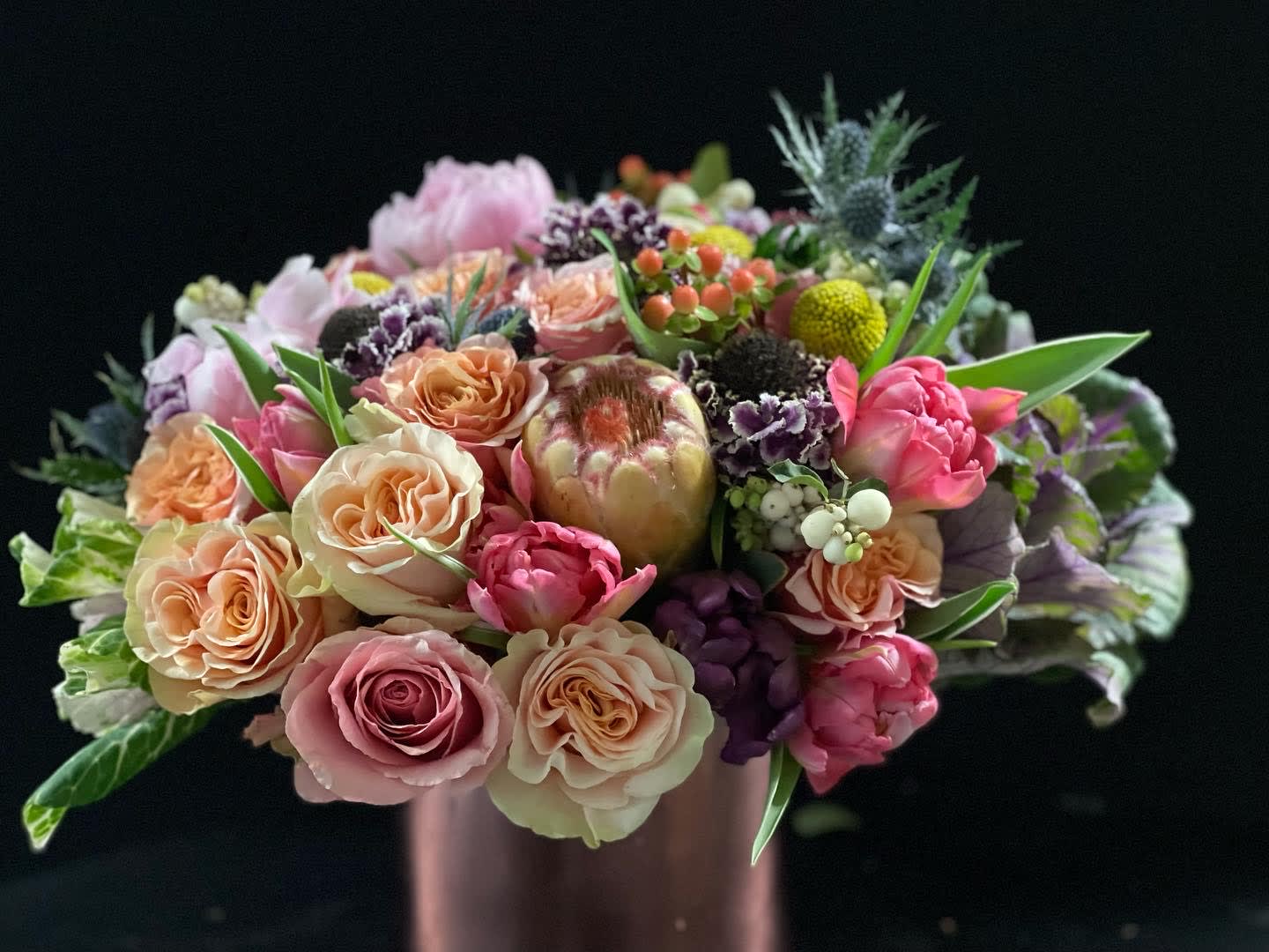 Fall Beauty.  - Garden style roses, scabiosa, ranunculus, proteas just to name a few. This stunning beautiful will take her breath  away.   Pictures with bigger bowl and more flowers is the $500.  $600 will have more peonies and a Cymbidium orchid. 