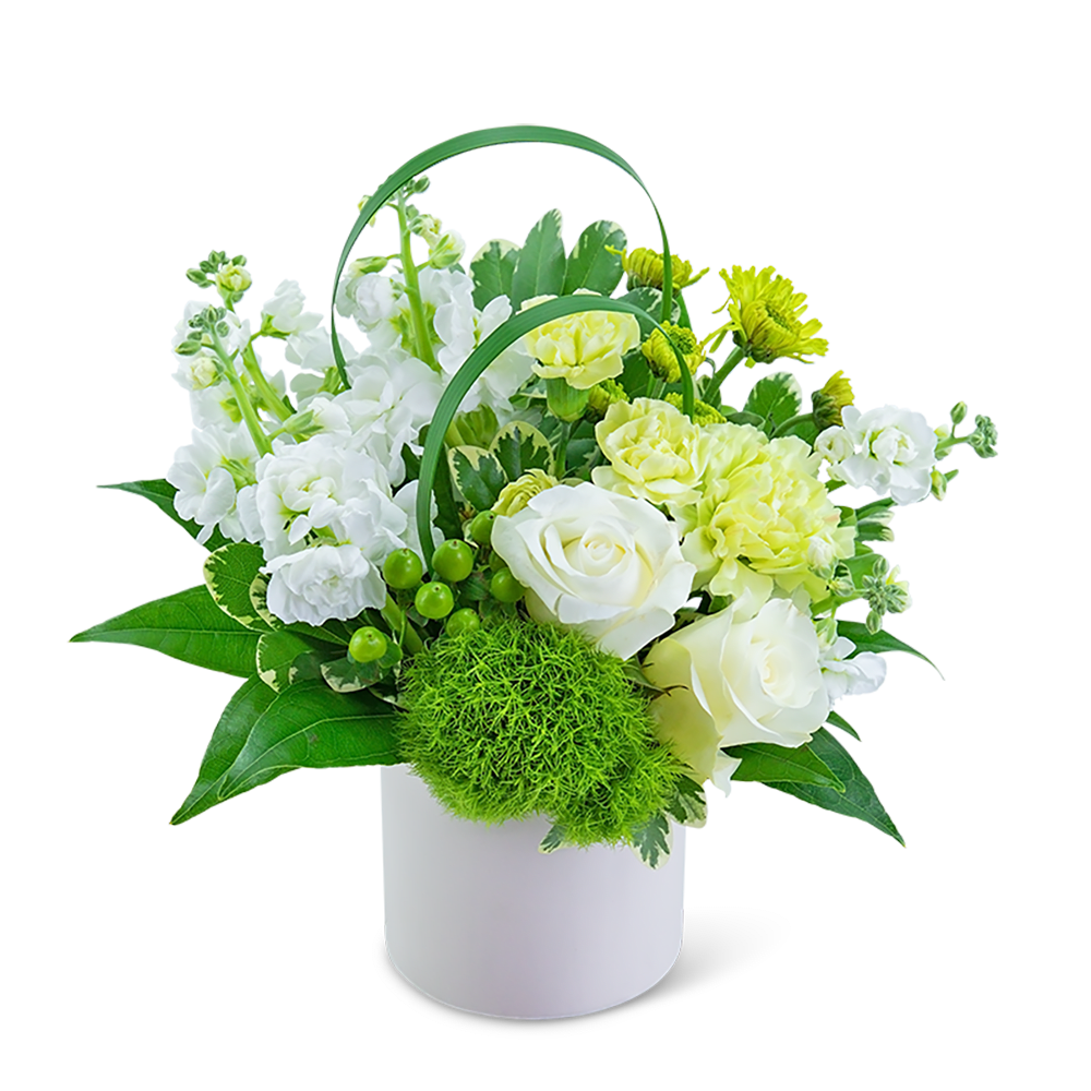 White and yellow floral arrangement in a white container with green handles