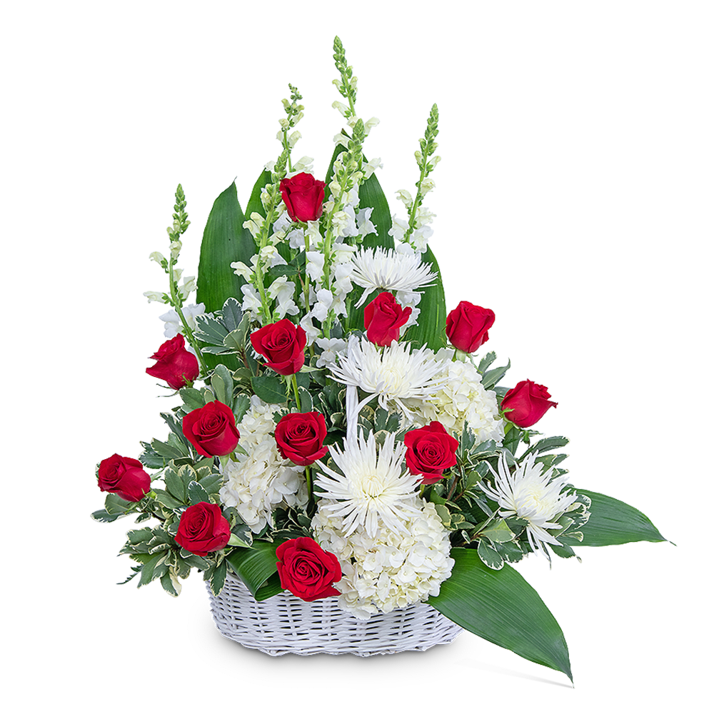 Red roses and white flowers in a white basket
