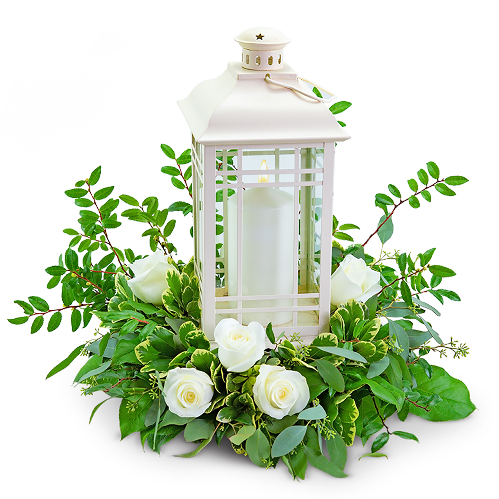 White lantern centerpiece with roses and greenery
