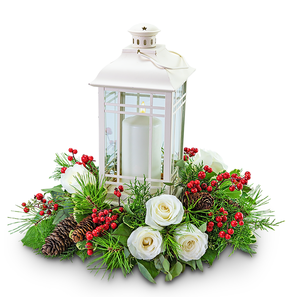 White lantern centerpiece with candles, roses, berries, and pinecones