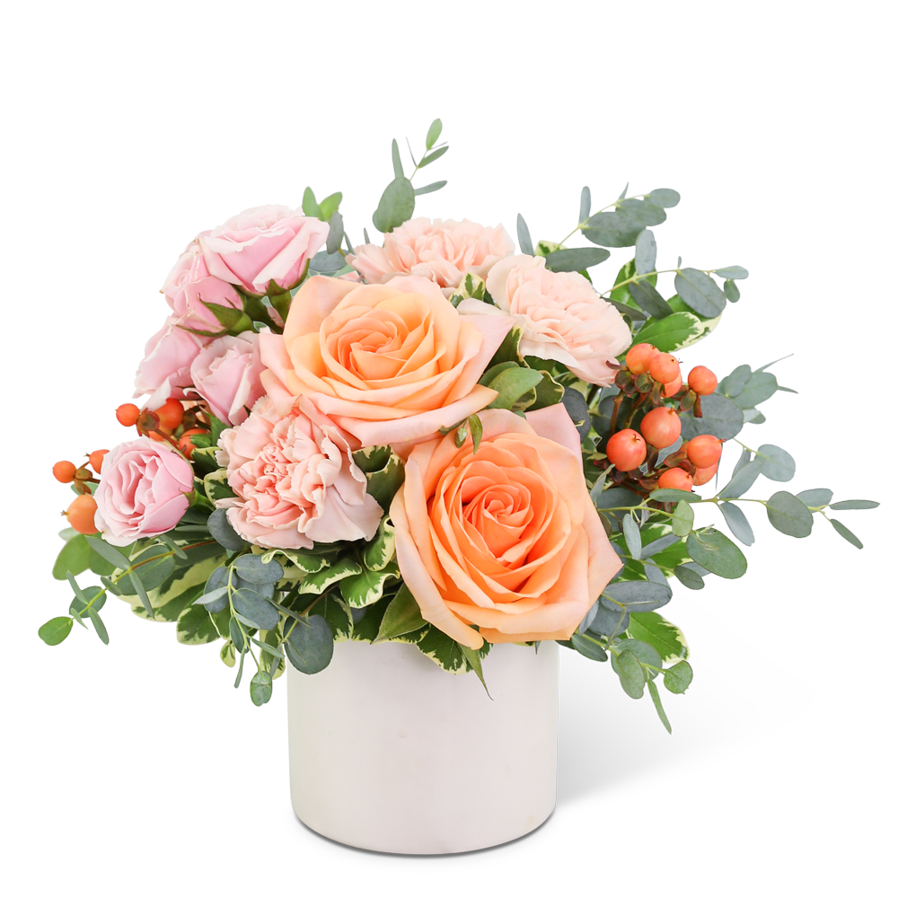 Pink and peach roses in a white vase