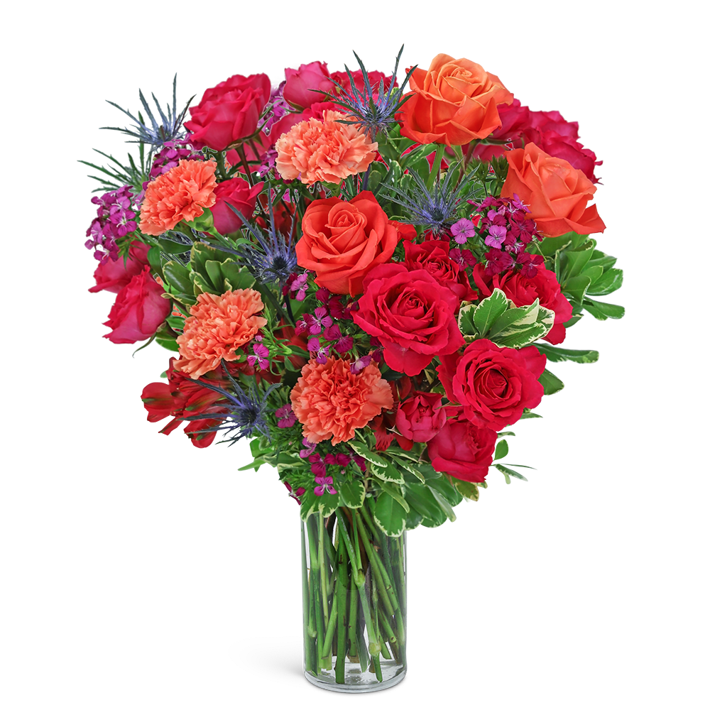 Mixed bouquet of red and orange roses in a clear glass vase