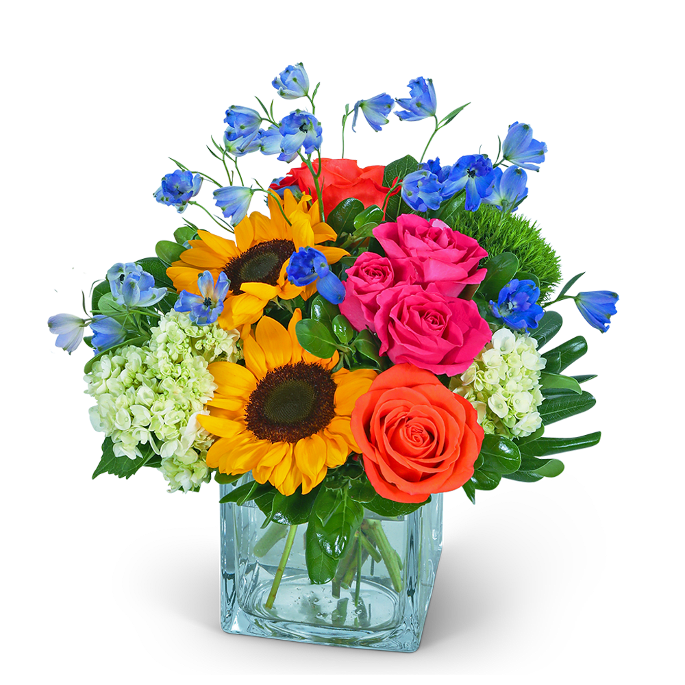 Mixed bouquet with sunflowers, roses, hydrangeas, and blue flowers in a glass vase