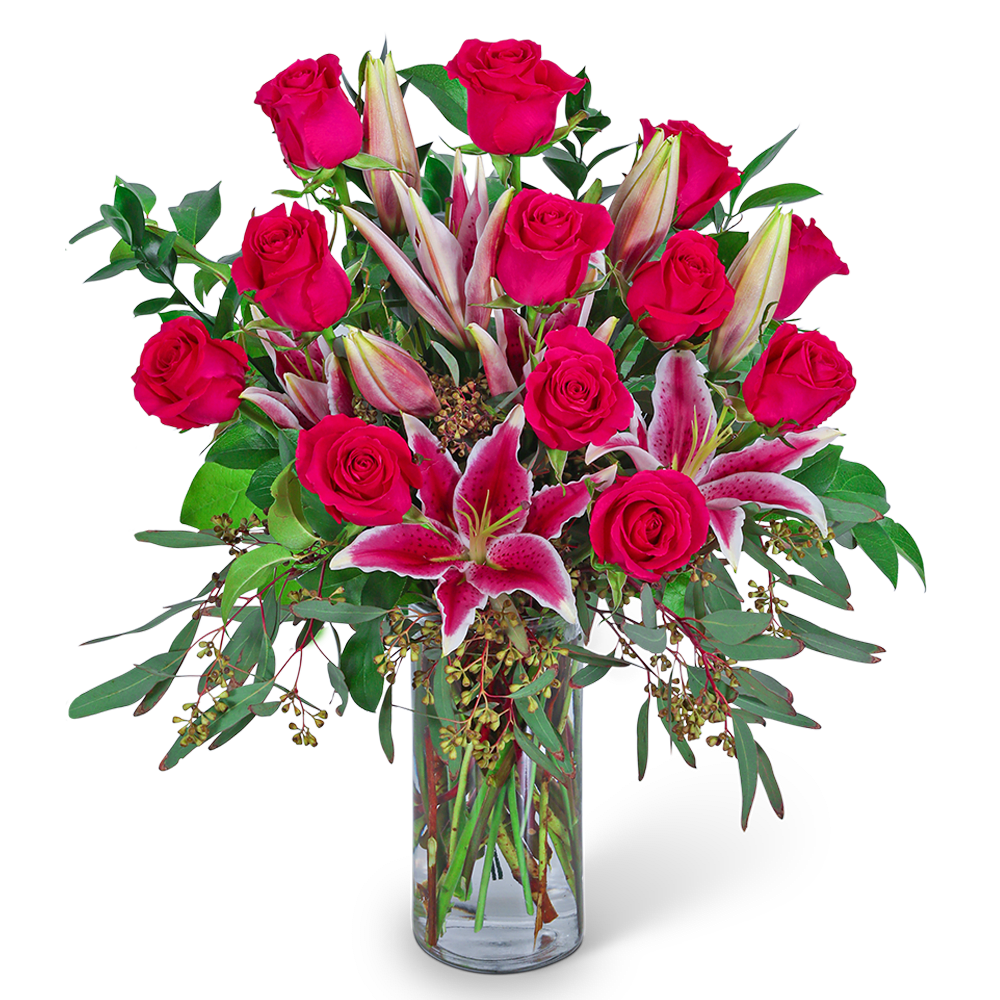 Pink roses and stargazer lilies in a clear glass vase