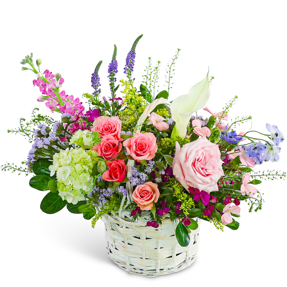 Mixed bouquet in a white wicker basket with pink roses and a white calla lily