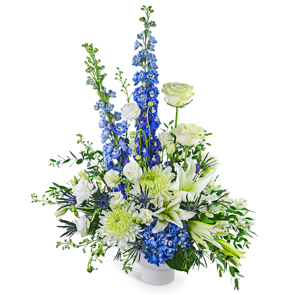 White and blue floral arrangement in a white vase