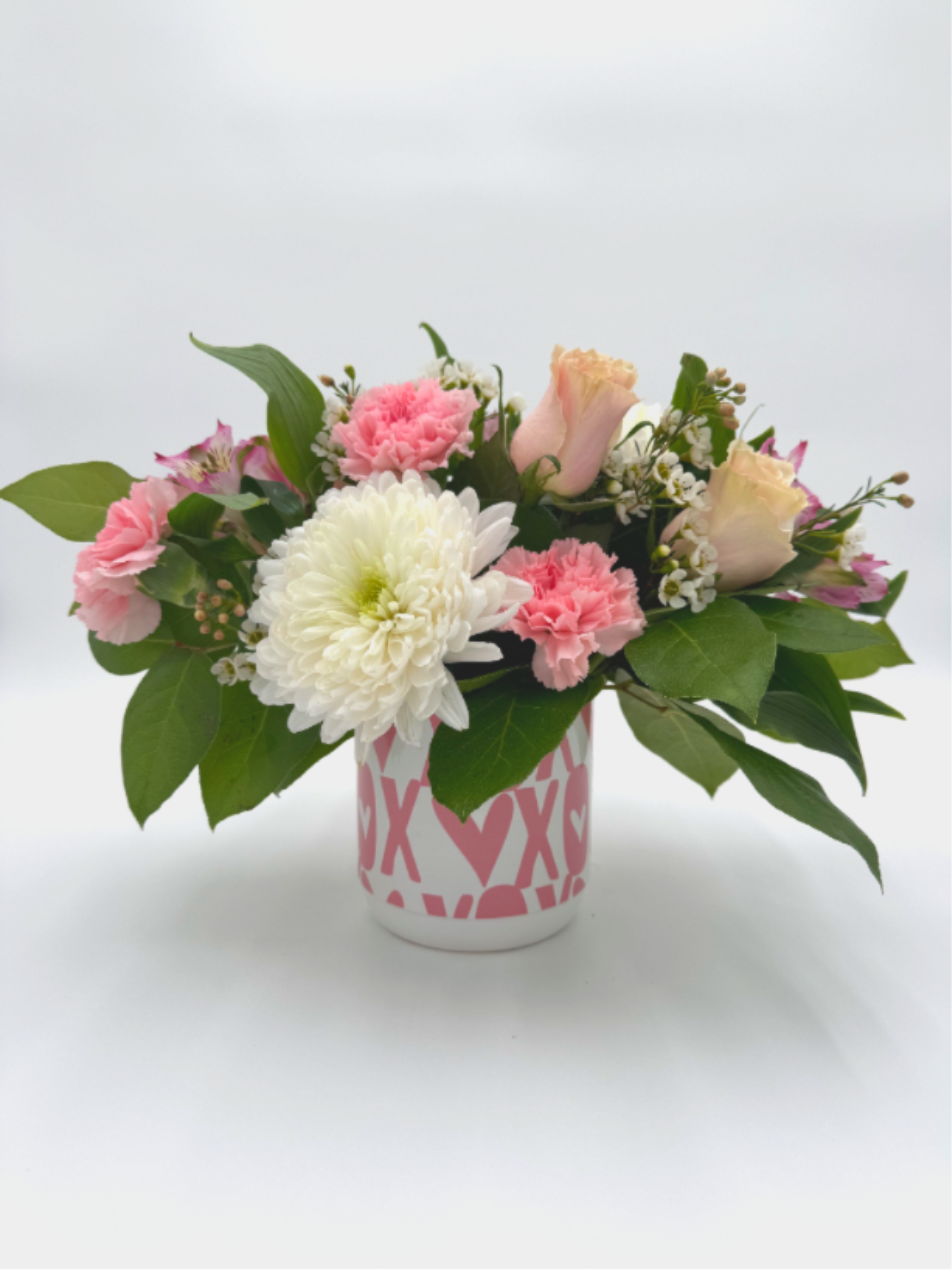 Blush &amp; Bloom - A delicate mix of blush roses, soft pink carnations, creamy white mums, and fresh greenery designed in a charming keepsake container. Blush &amp; Bloom is the perfect way to share love, gratitude or a little everyday joy