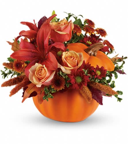 Autumn's Joy by Teleflora - Fall in love with this charming arrangement. Orange roses dark orange asiatic lilies bronze button spray chrysanthemums and burgundy copper beech leaves fill our best-selling ceramic pumpkin. It's a versatile keepsake that adds character all season long. This rustic arrangement includes orange roses and asiatic lilies bronze button spray chrysanthemums and red daisy spray chrysanthemums finished with accents of burgundy copper beech brown china millet and brown and yellow oak leaves. Delivered in a ceramic pumpkin.Approximately 13 1/2" W x 12" H Orientation: One-Sided As Shown : T12H110ADeluxe : T12H110BPremium : T12H110C