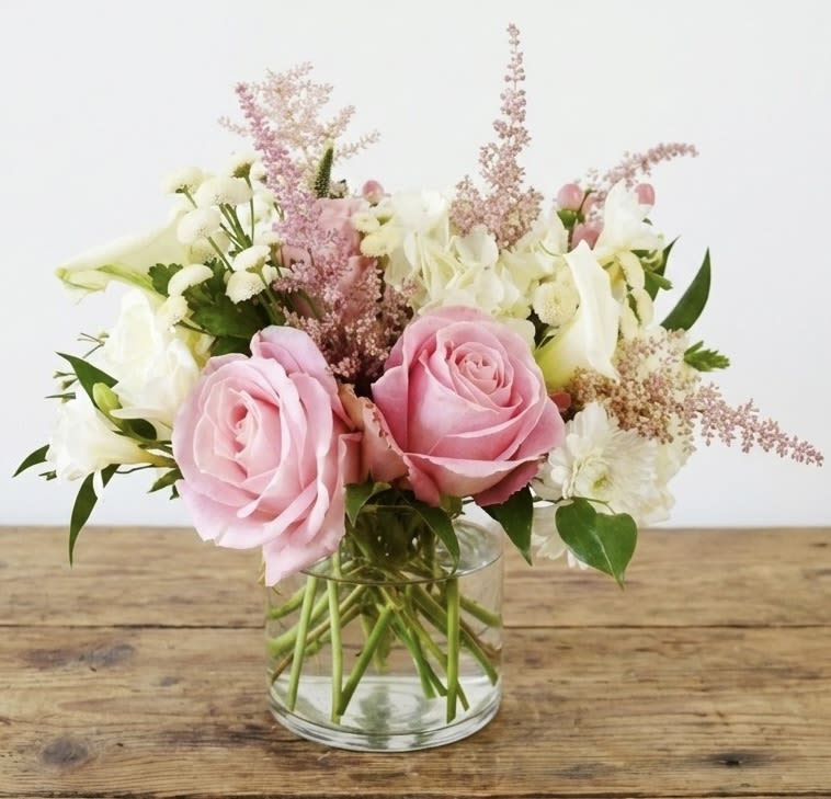 Pink Quartz - This arrangement features pastel color Hersoma rose, white calla lily, white hydrangea, white rose, light pink color astilbe and pink hypercium. It's perfect for a sweet soft color. 