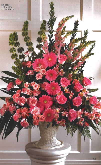 sympathies standing vase - mix of pink and green flowers in white vase