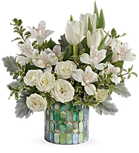 White tulips and roses arranged in a mosaic vase