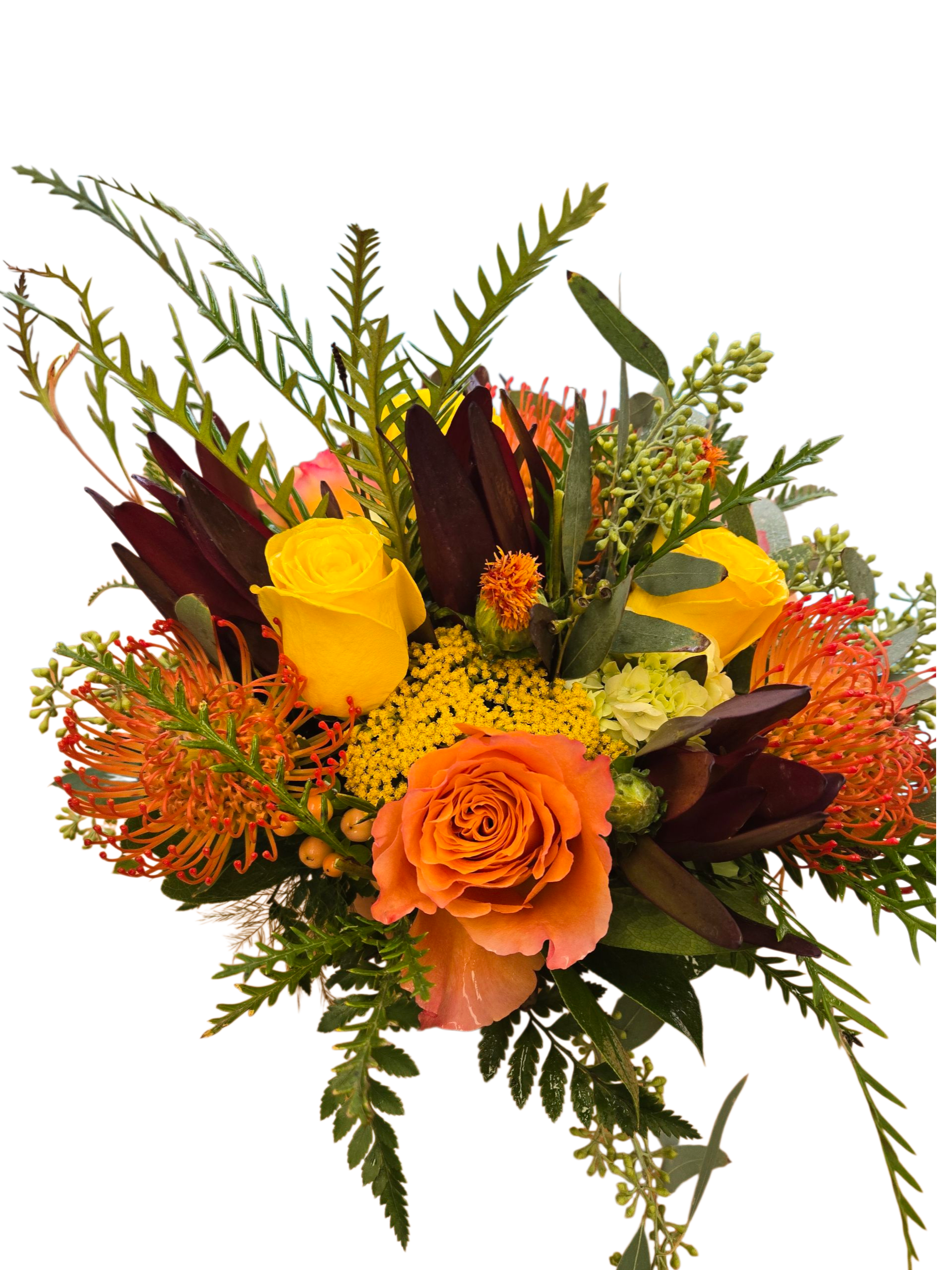 Orange and yellow roses with orange pincushion blooms in a bouquet