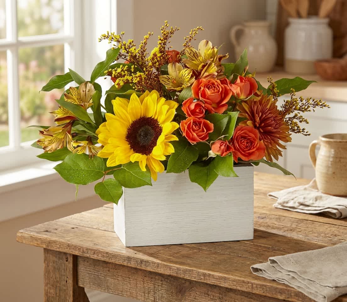Sunflower and orange rose arrangement in a white rectangular box