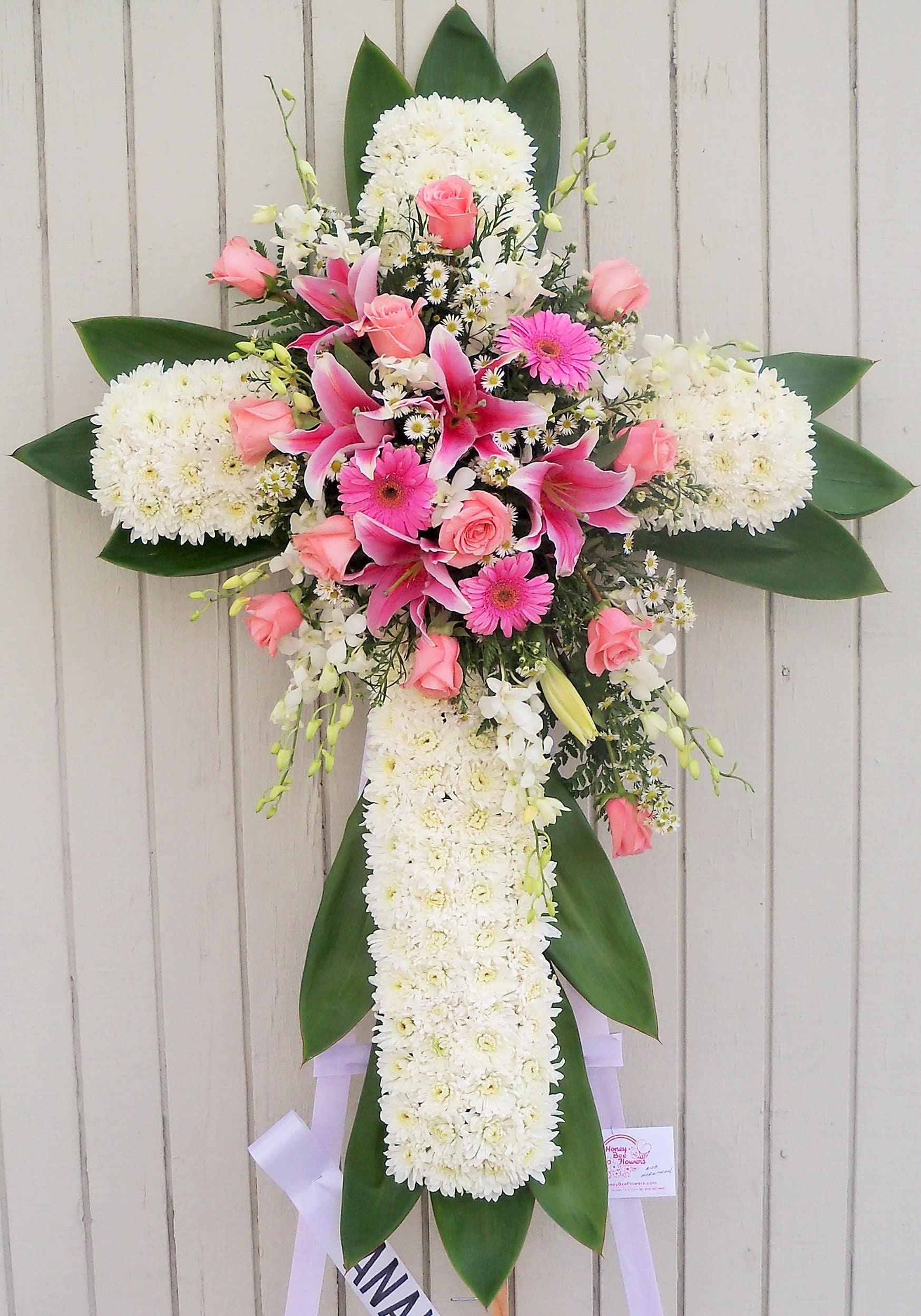 Cross-shaped floral spray with pink and white flowers