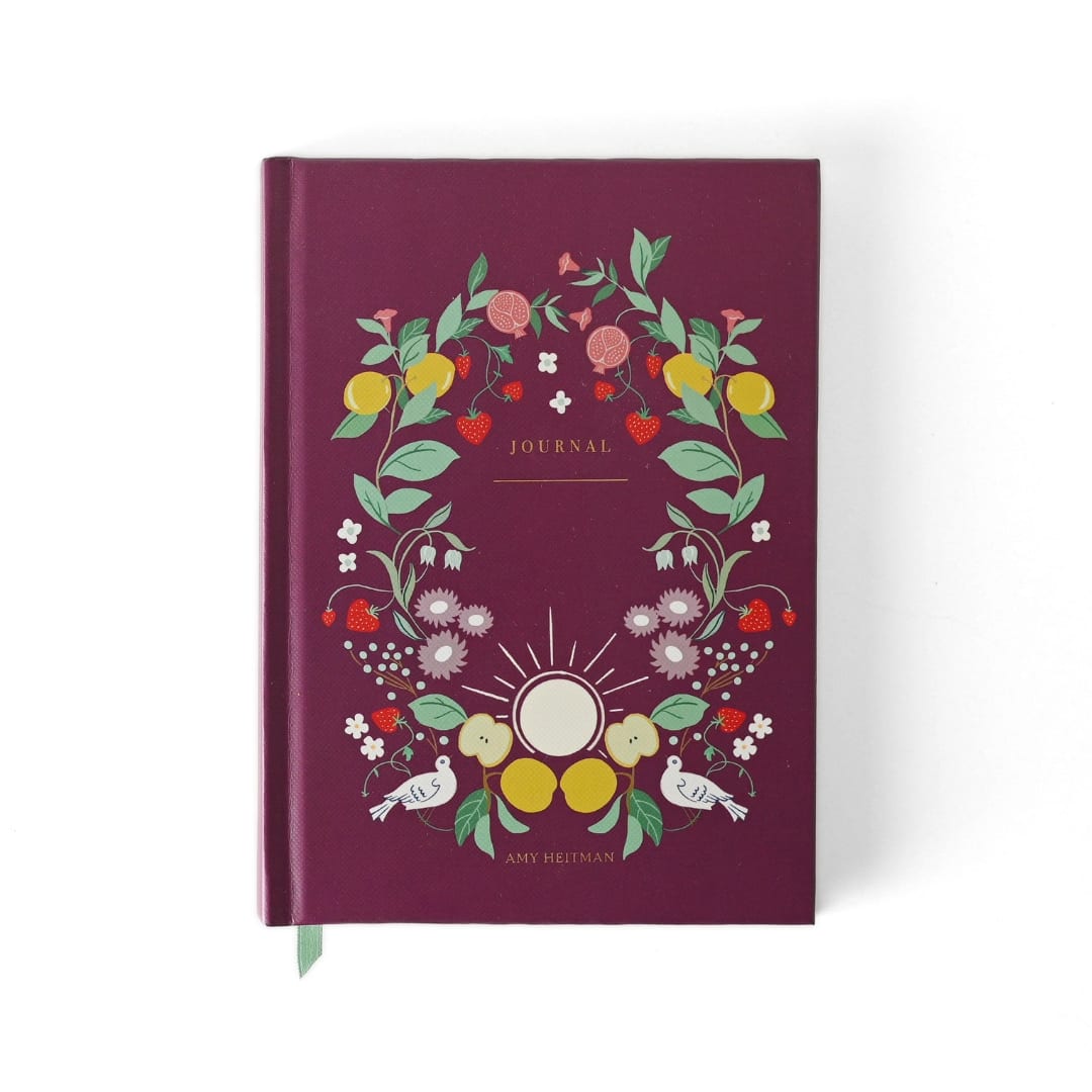 Maroon journal with a floral fruit wreath cover design