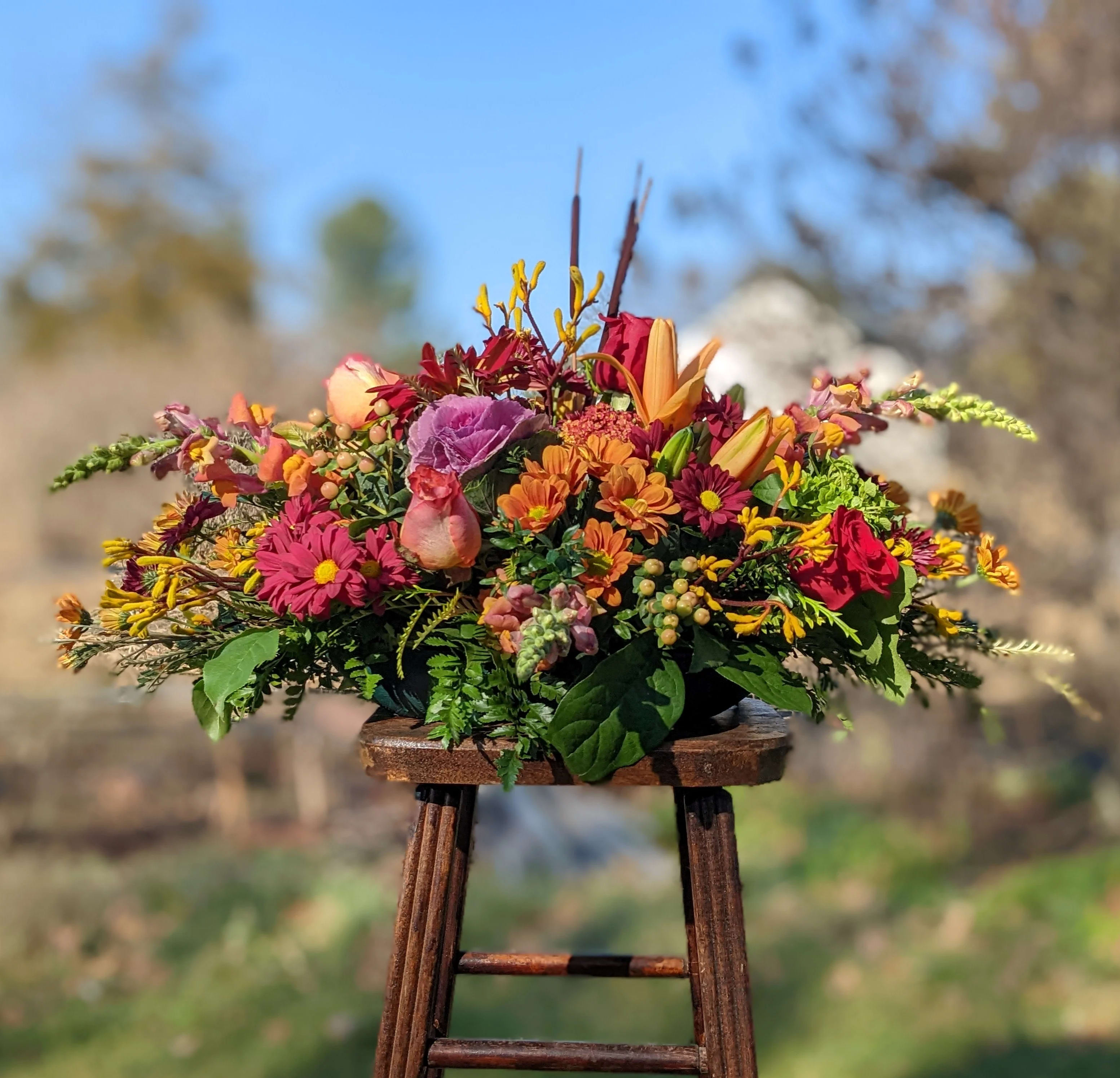 Magnificent Autumn - A classic long and low centerpiece, it touches on all of the fall feels.