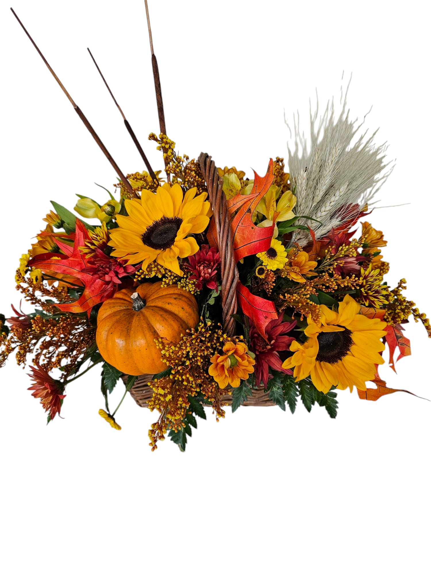 Autumn basket arrangement with sunflowers, a pumpkin, and dried grasses