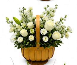 Pure Bliss Basket  - Woven basket arrangement of white roses with white lilies, carnations, and alstroemeria for a clean, elegant look.