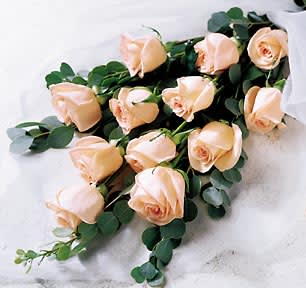 Dozen roses Wrap bouquet  - Available in many beautiful colors, our dozen roses wrap bouquet is one of the best in shop seller. Call for freshest arrivals of the day. Upgrades provide respectively 6 and 12 extra stems. 