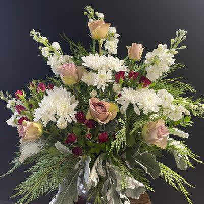 Bouquet of white chrysanthemums and blush roses with greenery
