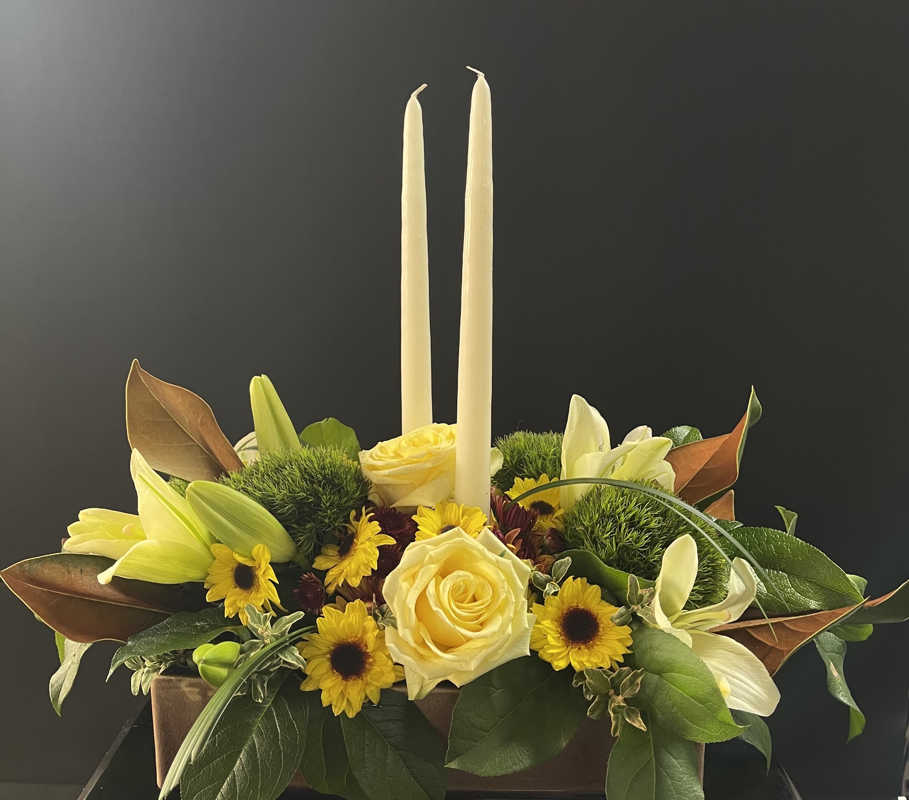 Rustic Centerpiece  - This rustic ceramic rectangular container hold an abundance of lush florals to complement your dinner table. Simple yet elegant in yellows, rusts, burgundy, rich greens and browns.