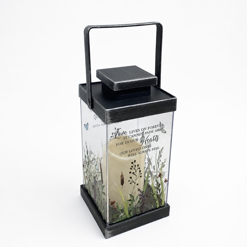 Black lantern with a candle and memorial text inside