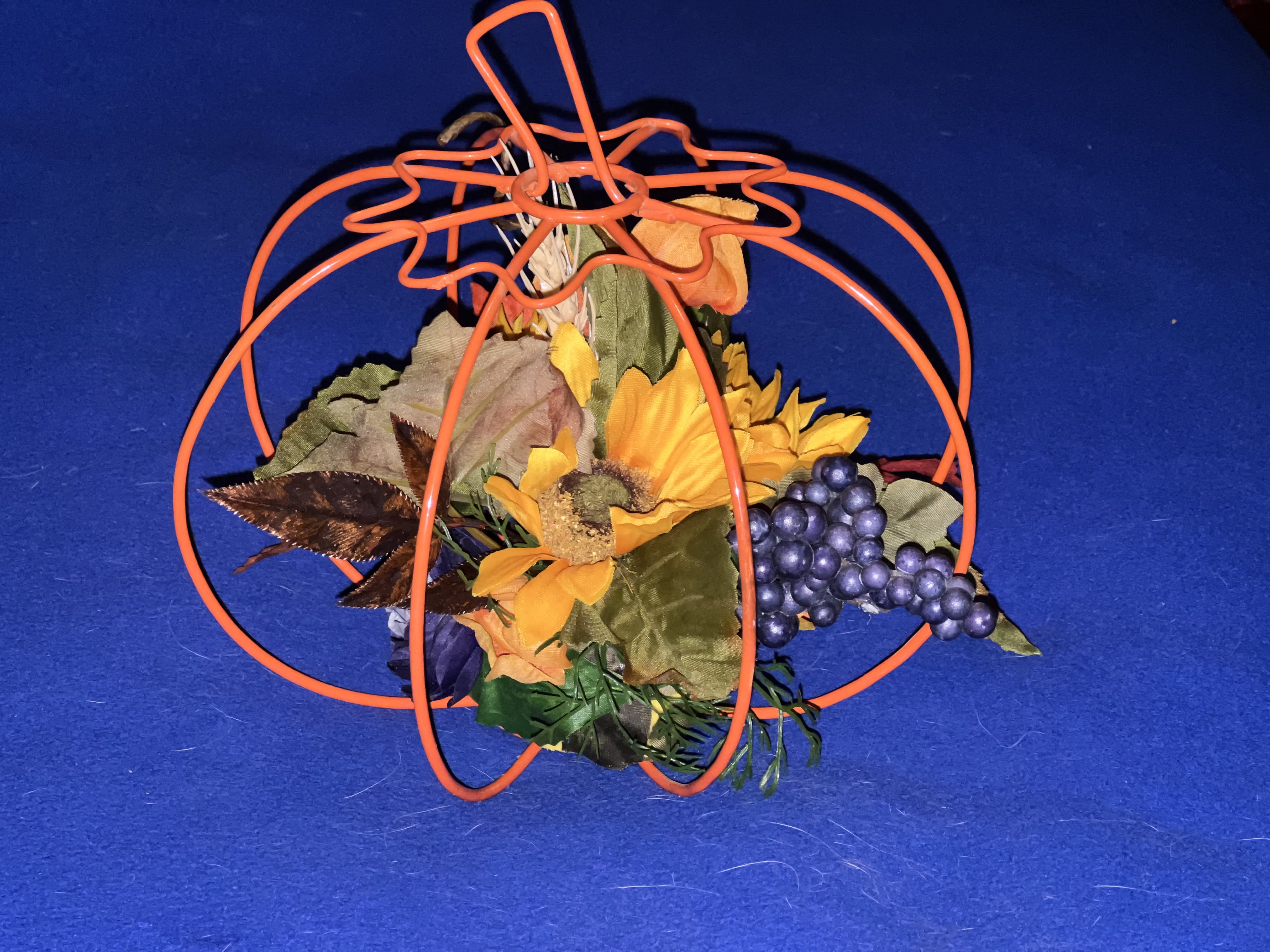 Autumn Table Decor - Our Autumn Table Decor, is perfect for front &amp; center of your table setting. Created out of a metal wired pumpkin, surrounded with special fall colored silk flowers. Reuse year after year. (only 1 available) 