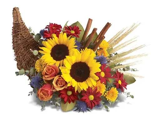 Bouquet with sunflowers, roses, and red daisies in a wicker cornucopia