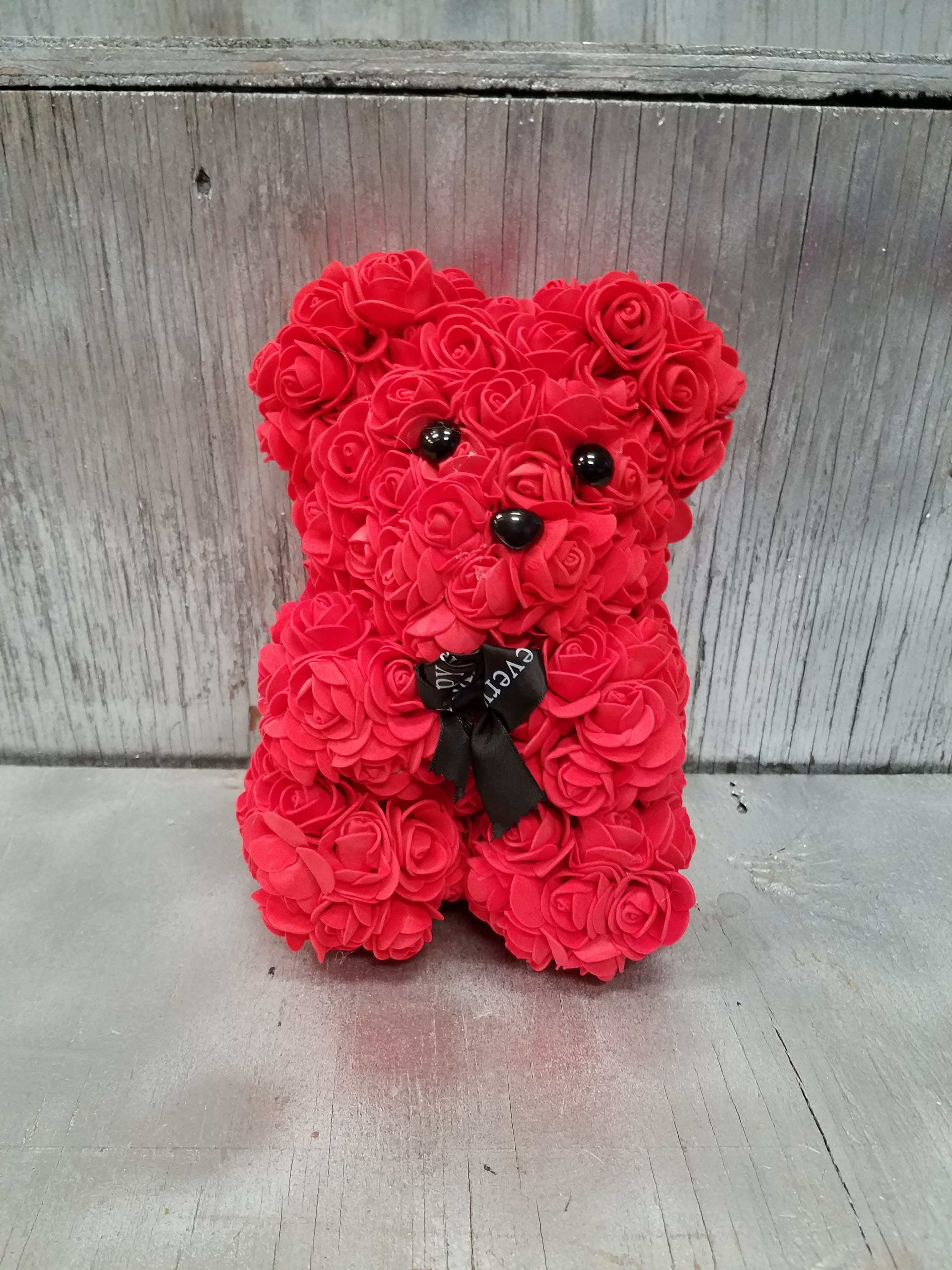 Red rose teddy bear with black eyes and ribbon bow