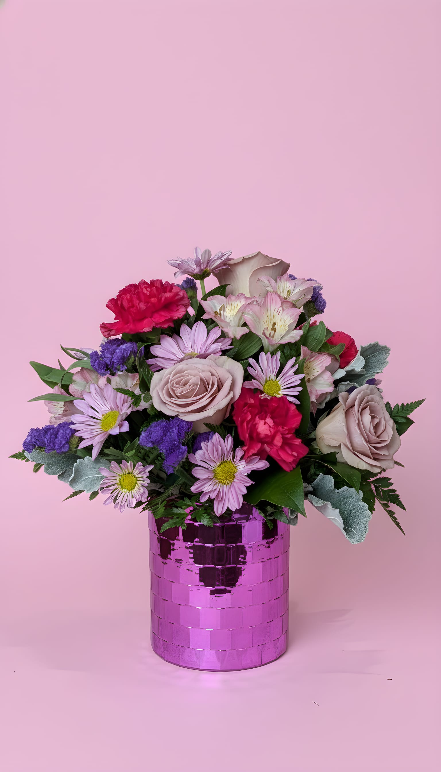 Dancing Queen (designers choice) - A cheerful, feminine arrangement that reads like a celebration in pinks and purples-perfect as a birthday bouquet, anniversary flowers, or a thoughtful "thinking of you" surprise. The overall impression is joyful and slightly romantic, made to make the person you're thinking of feel cherished and seen. All around Height varies due to selection of price point.