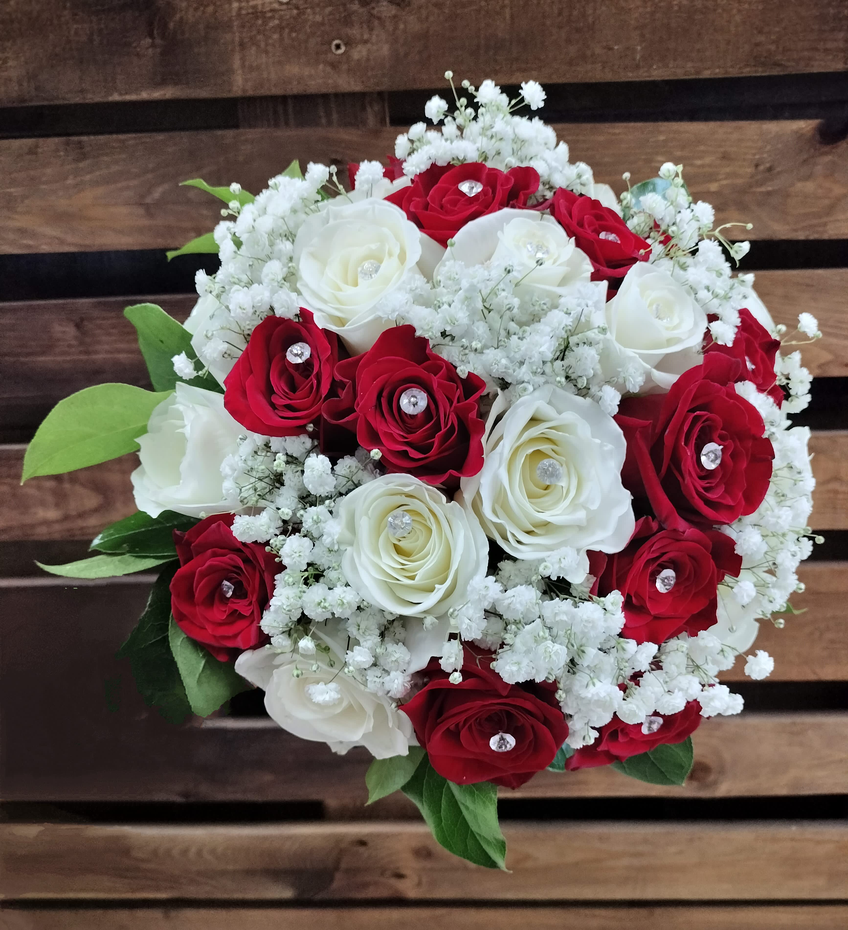 Bouquet of red and white roses with baby's breath