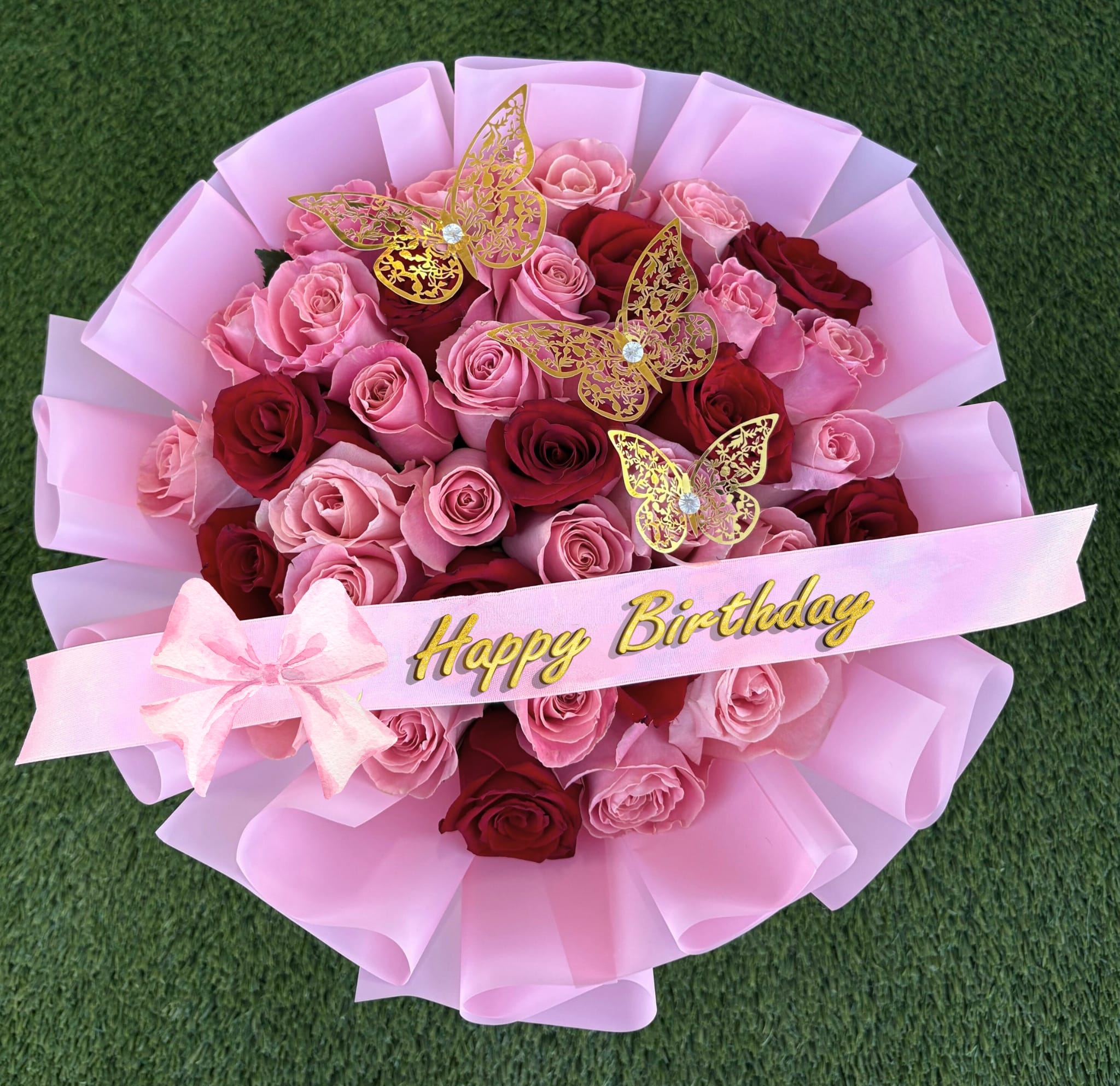 Pink and red rose bouquet with a Happy Birthday ribbon