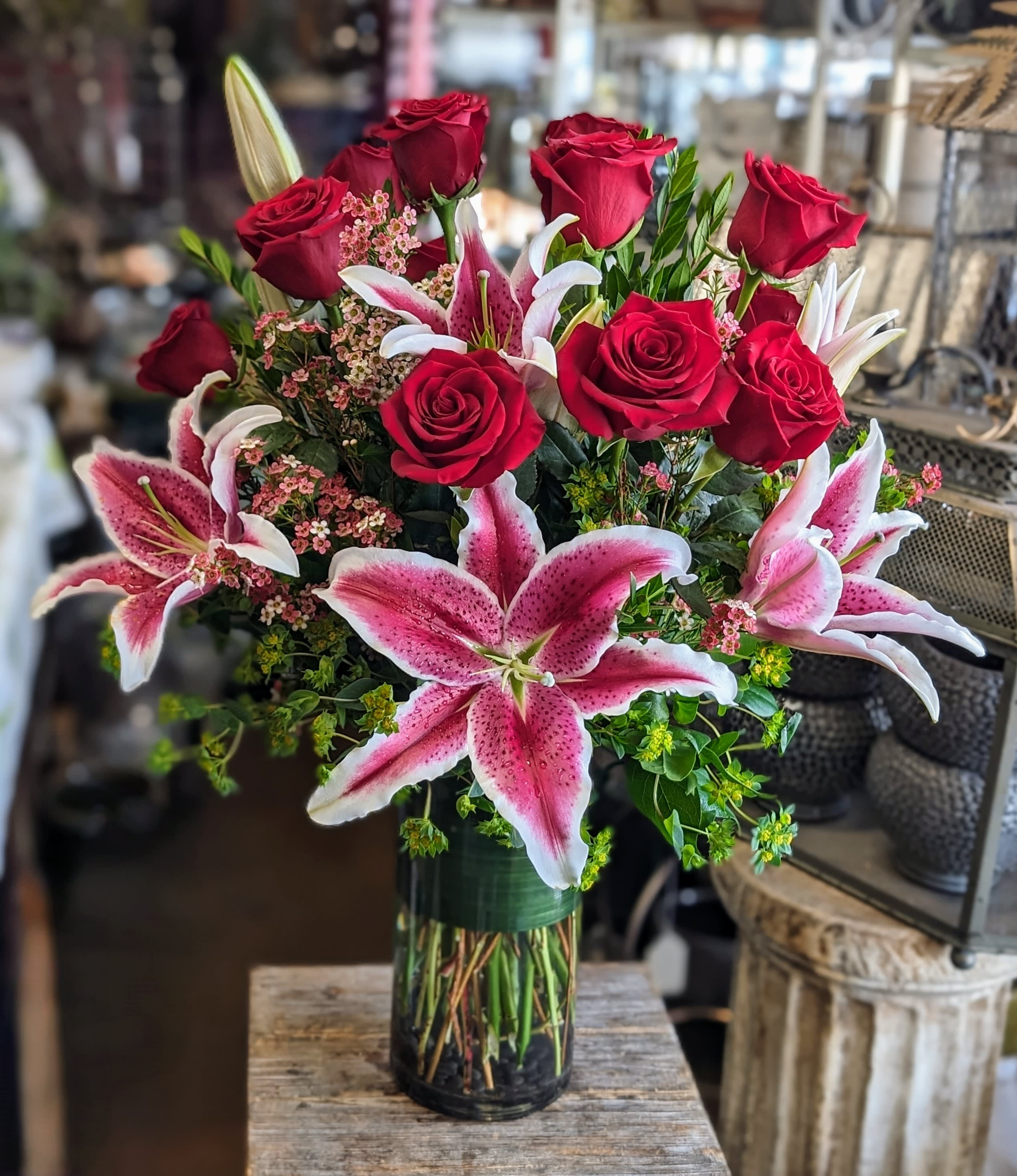 Sweet - Sweet Graceful, romantic, and full of heartfelt emotion, Sweet is a timeless floral arrangement from Windmill Floral Expressions in Las Vegas, designed to celebrate love in its purest form. Featuring velvety red roses and bold pink stargazer lilies, this elegant composition radiates passion, beauty, and affection.  The deep red roses offer a classic expression of devotion, while the star-shaped lilies add drama and sophistication with their vibrant pink petals. Soft clusters of pink waxflower and fresh green filler create texture and balance, enhancing the overall design with delicate detail.  Arranged in a tall, clear glass cylinder vase with polished stems and a band of greenery inside, Sweet delivers a romantic message with modern elegance—ideal for anniversaries, Valentine’s Day, or simply saying “I love you.”  Las Vegas Luxury Flowers – Elegant Arrangements to Impress. Same-day delivery available.