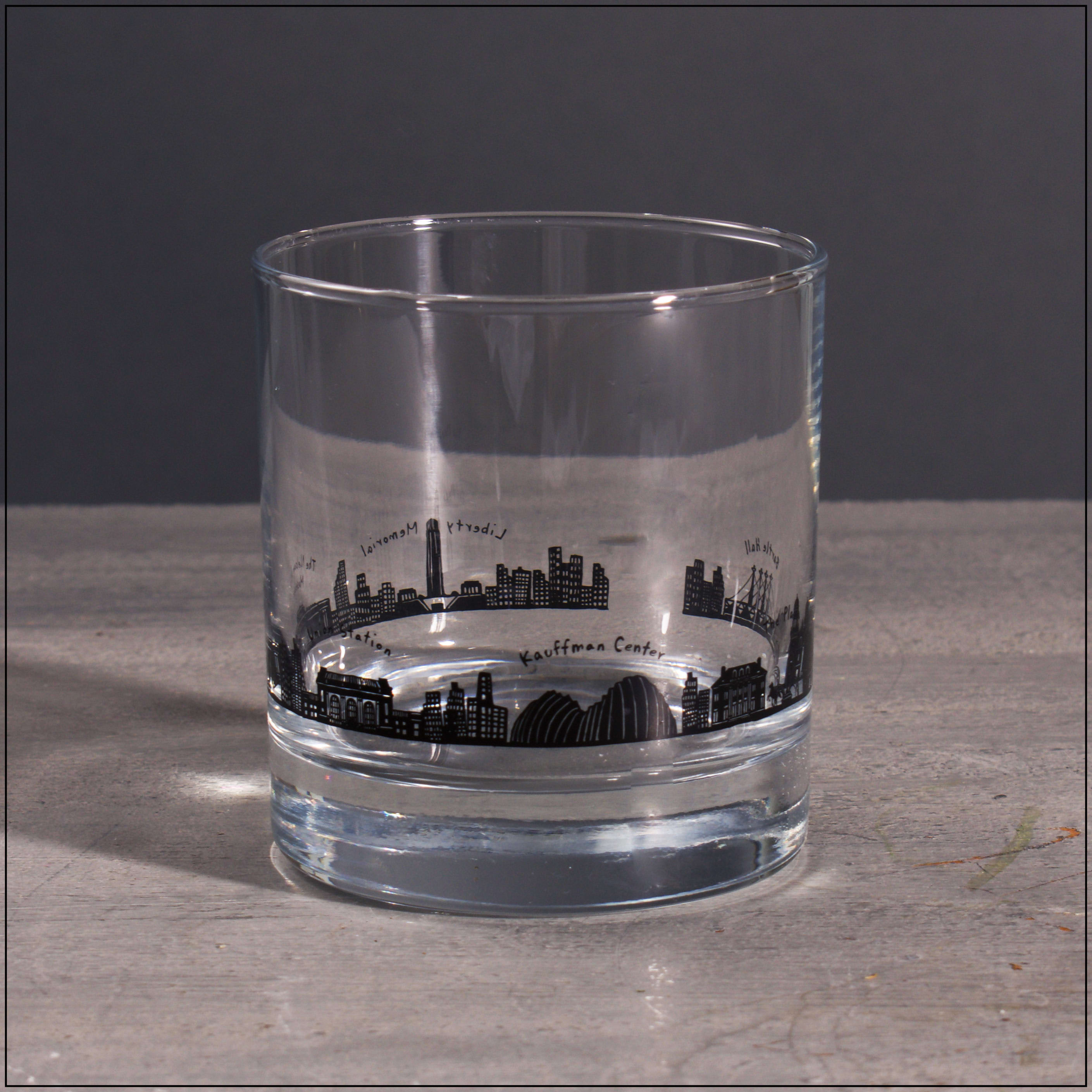 Clear glass tumbler with a black city skyline design