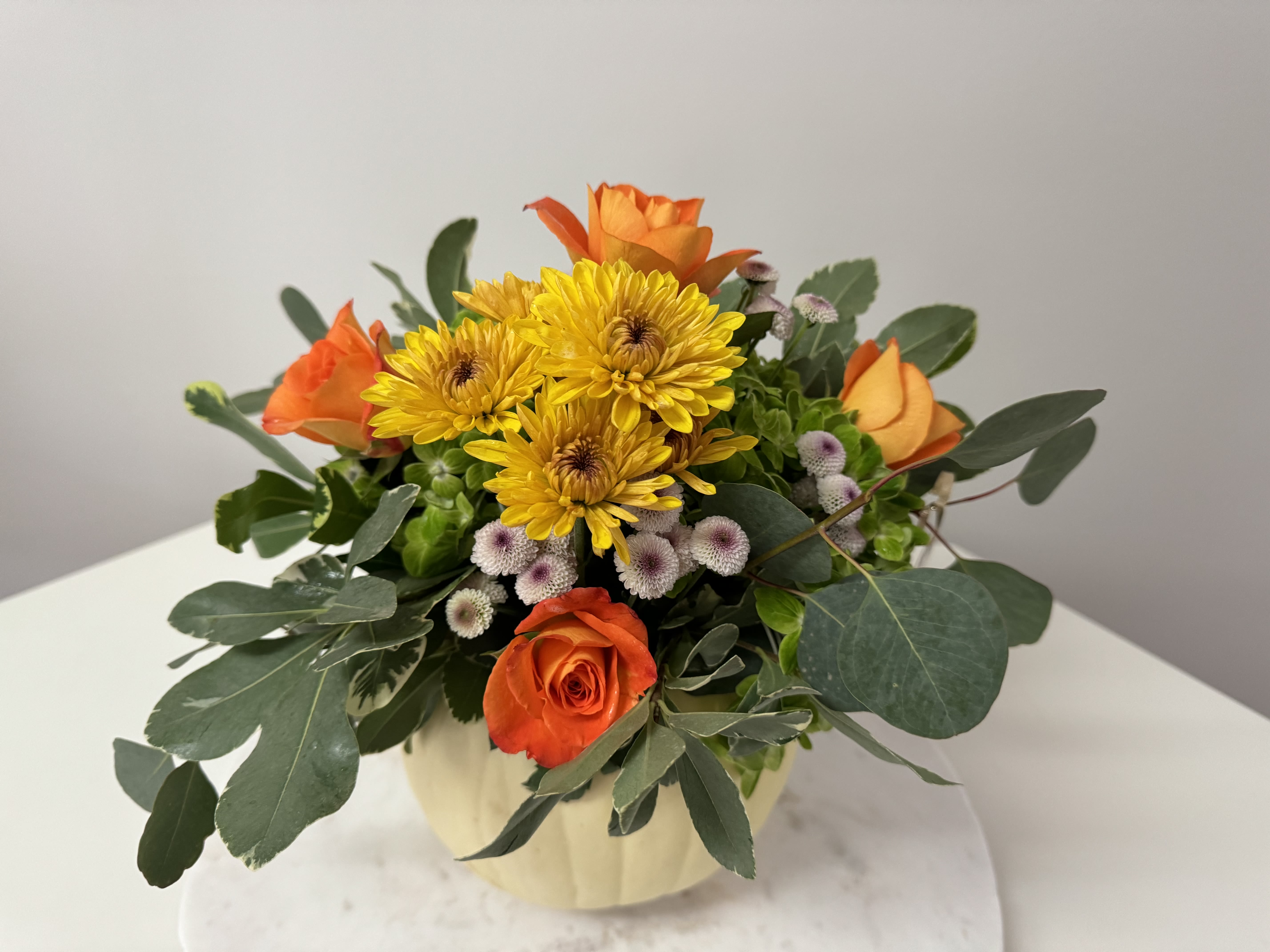 Pumpkins  Lush - A natural and fresh pumpkin with flowers with  fall colors the decorate your dining table or any place where you  welcome Fall season and celebrate Thanksgiving .