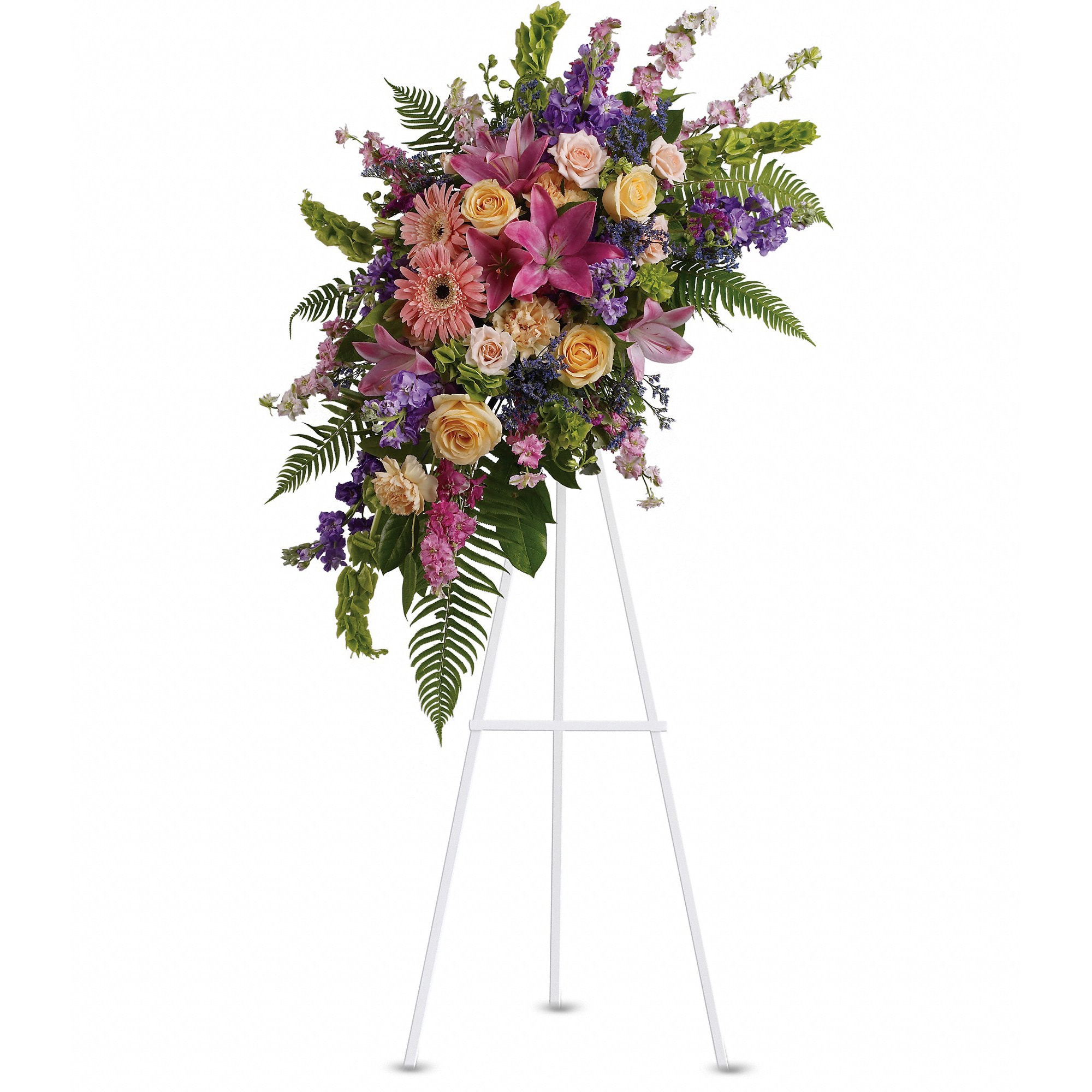 Tall floral spray on a white easel with pink, purple, and yellow blooms
