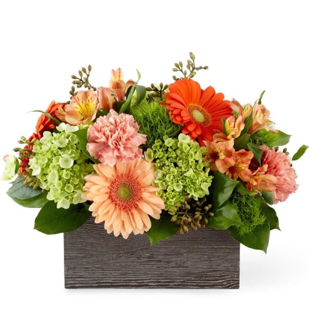 Mixed bouquet in a rectangular wooden box with orange and peach blooms