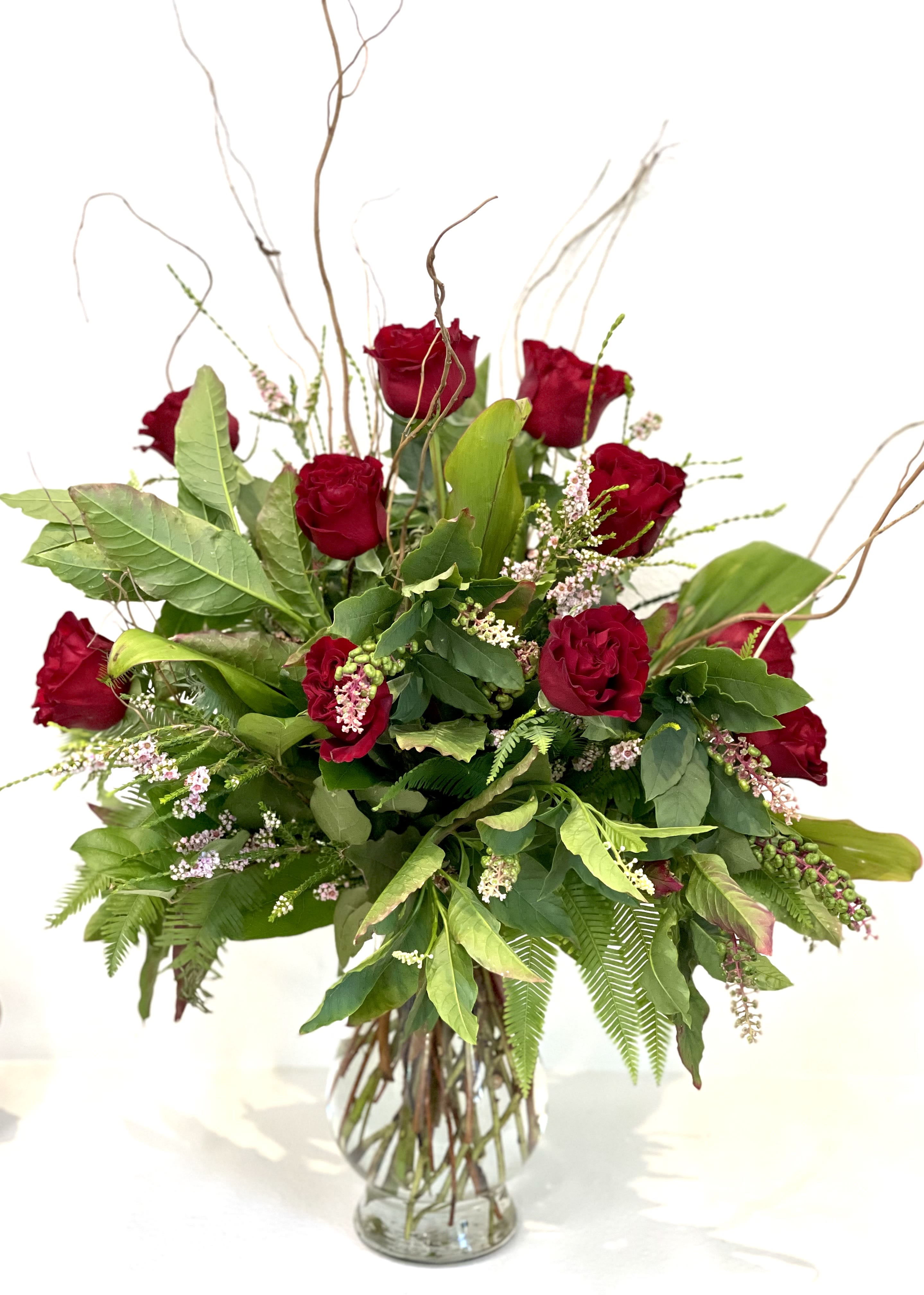 Hearts - A modern gift of a dozen red roses. Upgraded greenery and gorgeous fillers.