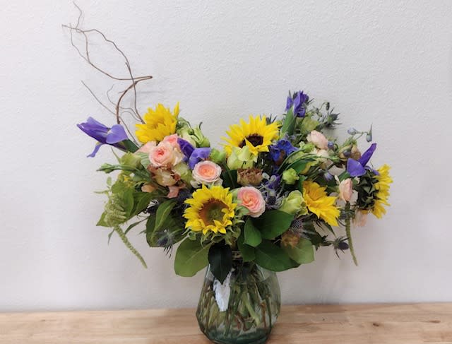 Wild at Heart - A cheerful collection of yellow and blue flowers designed in a playful manner.