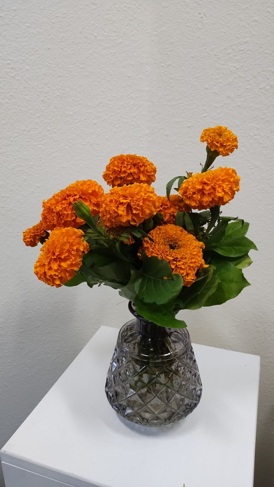 Field of Marigolds - A simple arrangement of marigolds set in a gorgeous keepsake smoke vase