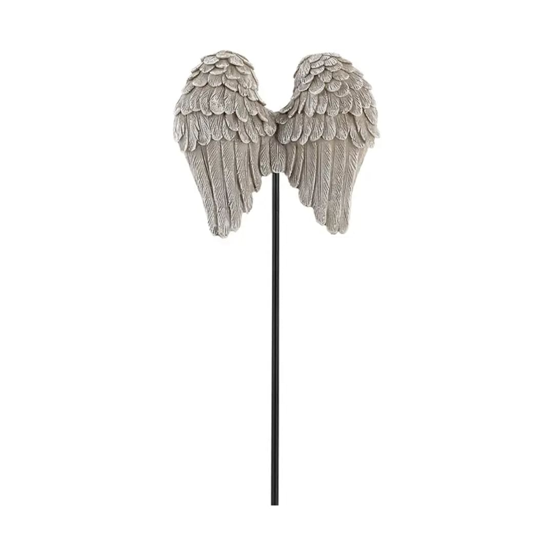 Decorative angel wings on a black stake against a white background