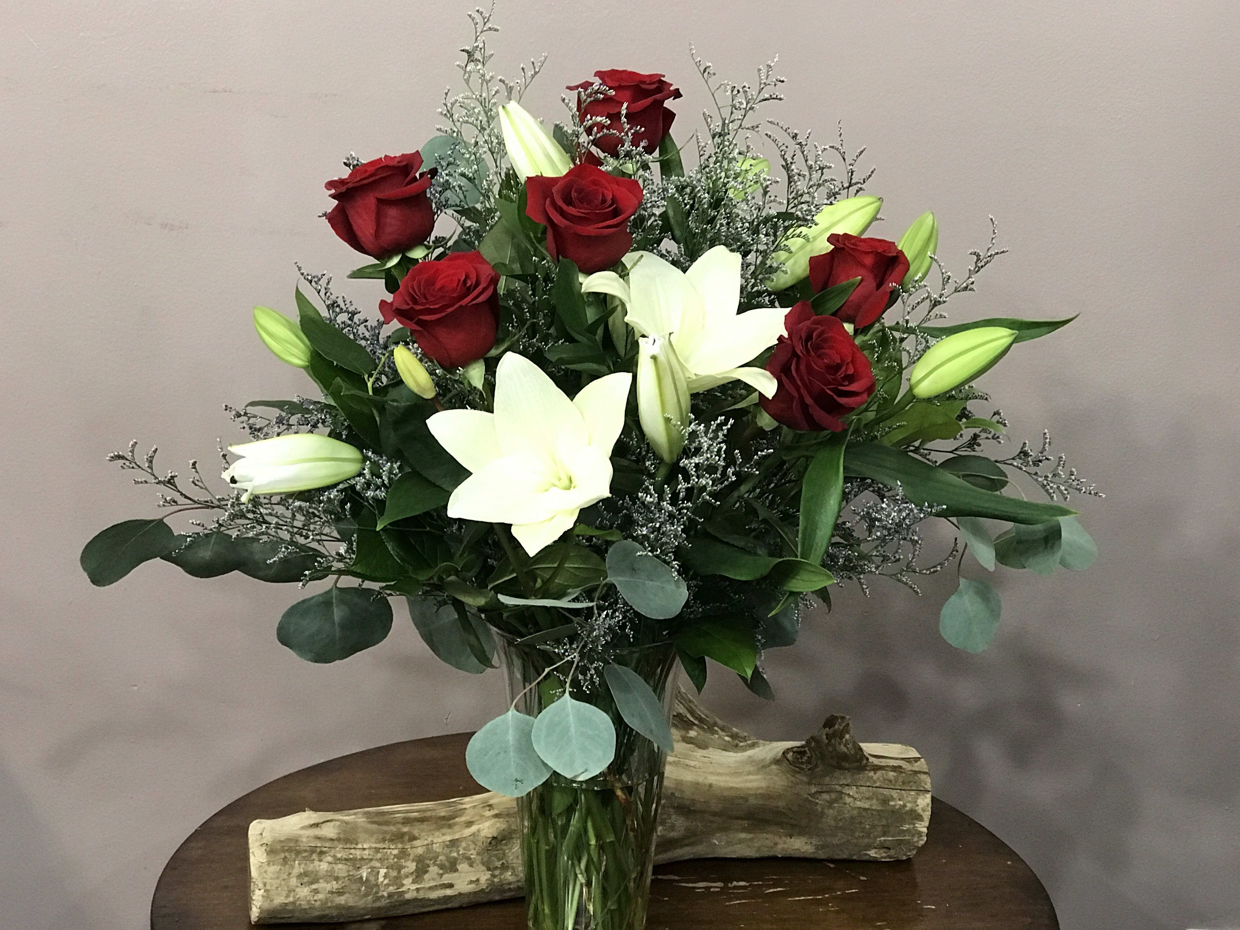 Lilies and Roses - Red roses and pure white lilies are two of the most elegant blossoms in nature; combined in one lovely floral arrangement, they create double the flower power!  A simple and elegant display that will make someone sit up and take notice.
