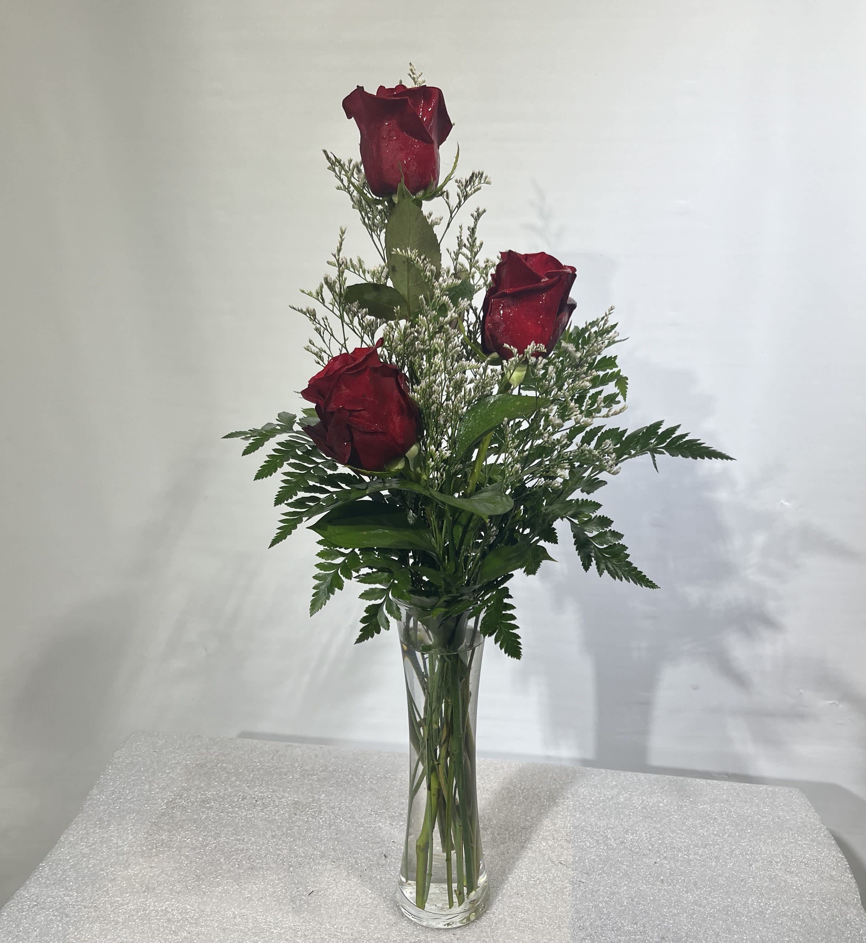 XO by BloomNation™ - Send a cute and sweet red rose bud vase to your love, your friend, or your relative for Valentine's day. Sending this arrangement is a lovely gesture and shows that you are thinking of them without breaking the bank!  Approximate Dimensions: 5"D x 15"H