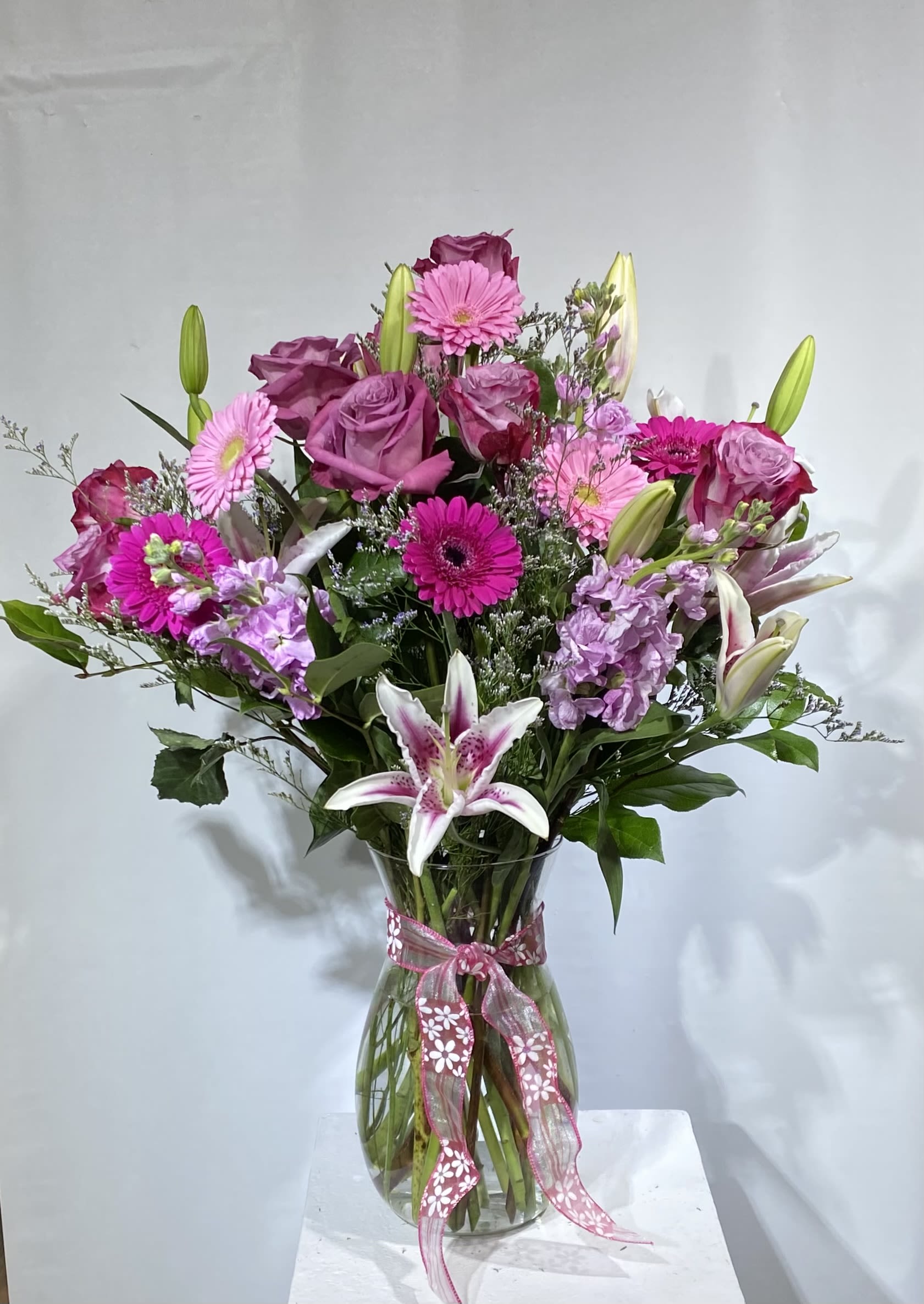 Awesome Anniversary - Show them how happy you are to have them in your life. A sparkling glass vase overflowing with favorite flowers for your forever-favorite.PREMIUM ARRANGEMENT PICTURED