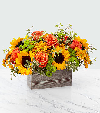 Sunflower and Rose  Box Arrangement  - Woodland box filled with sunflowers, roses and fall favorites. Colors may vary but they will represent the beauty of fall.