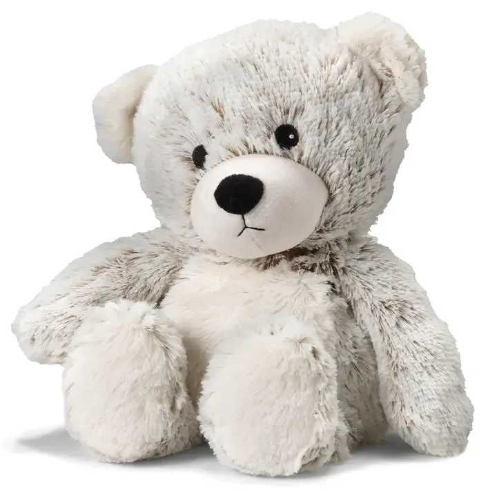 Plush teddy bear with white and gray fur sitting on a white background